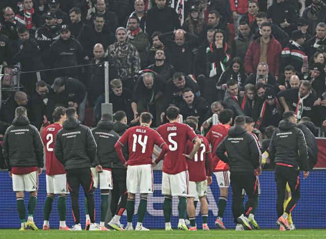 Hungary's team reacts at the end of the FIFA World Cup 2026 Group F European qualification football match betweem Hungary and Republic of Ireland at the Puskas Arena in Budapest, Hungary on Novemeber 16, 2025. (Photo by Attila KISBENEDEK / AFP)
