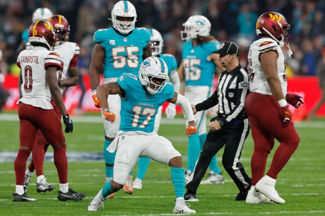Miami Dolphins' wide receiver #17 Jaylen Waddle reacts after a play during the NFL match between Miami Dolphins and Washington Commanders at Santiago Bernabeu Stadium in Madrid on November 16, 2025. (Photo by Oscar DEL POZO / AFP)
