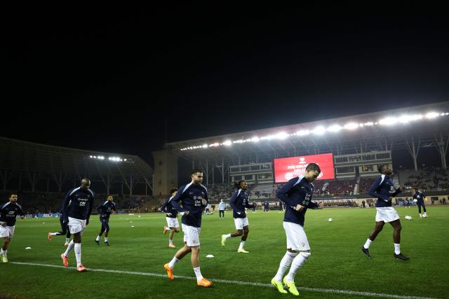 France's players warm up prior to the FIFA World Cup 2026 European qualification football match between Azerbaijan and France at the Tofiq Bahramov Republican Stadium in Baku on November 16, 2025. (Photo by Franck FIFE / AFP)