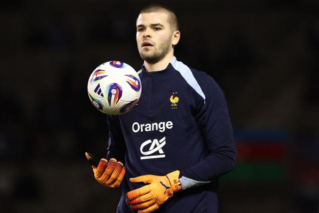 France's goalkeeper #23 Lucas Chevalier warms up prior to the FIFA World Cup 2026 European qualification football match between Azerbaijan and France at the Tofiq Bahramov Republican Stadium in Baku on November 16, 2025. (Photo by FRANCK FIFE / AFP)
