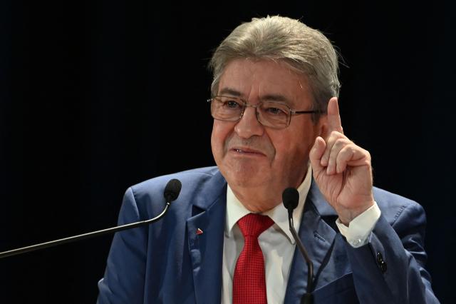 Founder of French left-wing party La France Insoumise (LFI) Jean-Luc Melenchon gestures as he gives a speech during a LFI meeting in Saint-Pierre-des-Corps, central France, on November 16, 2025. (Photo by JEAN-FRANCOIS MONIER / AFP)