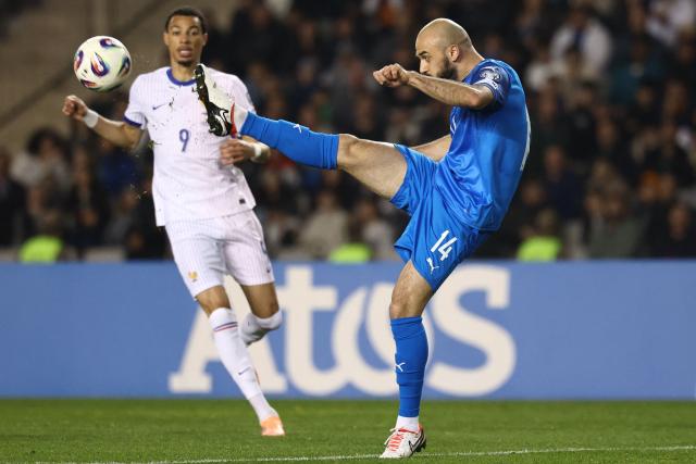 France's forward #09 Hugo Ekitike and Azerbaijan's defender #14 Elvin Badalov vie for the ball during the FIFA World Cup 2026 European qualification football match between Azerbaijan and France at the Tofiq Bahramov Republican Stadium in Baku on November 16, 2025. (Photo by FRANCK FIFE / AFP)