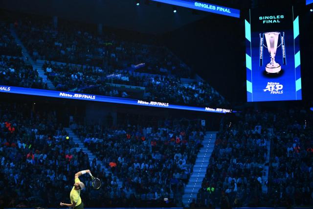 Spain's Carlos Alcaraz hits a return to Italy's Jannik Sinner during the men's single final match at the ATP Finals tennis tournament, in Turin, on November 16, 2025. (Photo by Marco BERTORELLO / AFP)