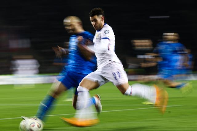 France's defender #22 Theo Hernandez in action during the FIFA World Cup 2026 European qualification football match between Azerbaijan and France at the Tofiq Bahramov Republican Stadium in Baku on November 16, 2025. (Photo by FRANCK FIFE / AFP)