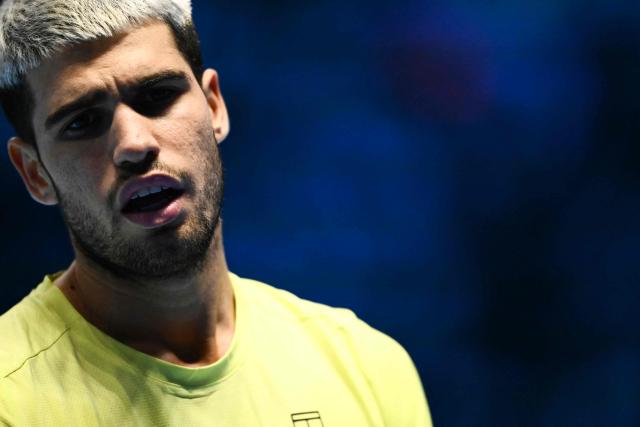 Spain's Carlos Alcaraz reacts during the men's single final match against Italy's Jannik Sinner at the ATP Finals tennis tournament, in Turin, on November 16, 2025. (Photo by Marco BERTORELLO / AFP)