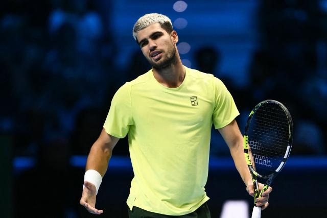 Spain's Carlos Alcaraz reacts during the men's single final match against Italy's Jannik Sinner at the ATP Finals tennis tournament, in Turin, on November 16, 2025. (Photo by Marco BERTORELLO / AFP)
