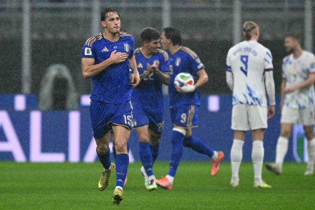 Italy's forward #15 Francesco Pio Esposito celebrates scoring his team's first goal during the FIFA World Cup 2026 European qualification football match between Italy and Norway, at the San Siro Stadium, in Milan, on November 16, 2025. (Photo by Stefano RELLANDINI / AFP)