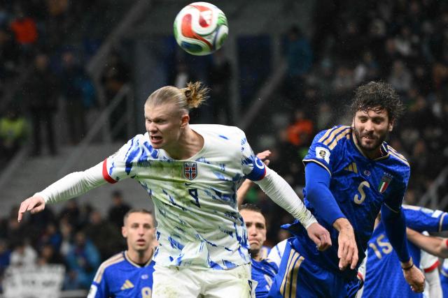 Norway's  captain #09 Erling Braut Haaland fights for the ball with Italy's forward #05 Manuel Locatelli during the FIFA World Cup 2026 European qualification football match between Italy and Norway, at the San Siro Stadium, in Milan, on November 16, 2025. (Photo by Alberto PIZZOLI / AFP)