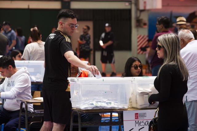 A man casts his vote during Chile's general election at a polling station in Antofagasta, Chile on November 16, 2025. Chileans are voting in a presidential election shaped by rising concerns over violent crime, with candidates pledging tougher measures against transnational gangs and the far-right promising to carry out mass migrant deportations. (Photo by SEBASTIAN ROJAS ROJO / AFP)