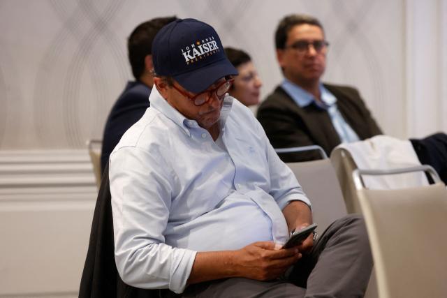 A supporter of Chile's presidential candidate Johannes Kaiser, of the Libertarian National Party, reacts after the first exit poll results of the general election in Santiago on November 16, 2025. (Photo by Raul BRAVO / AFP)