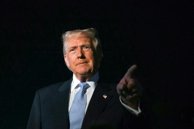 US President Donald Trump speaks with reporters before boarding Air Force One as he departs Palm Beach International Airport in West Palm Beach, Florida, on November 16, 2025. Trump is returning to the White House after spending the weekend at his Mar-a-Lago, Florida, residence. (Photo by Jim WATSON / AFP)