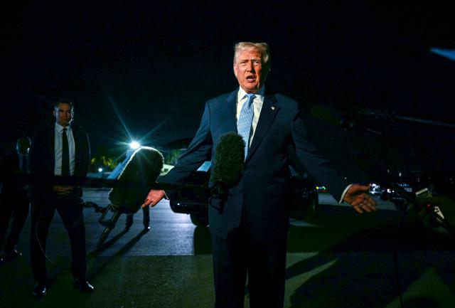 US President Donald Trump speaks with reporters prior to boarding Air Force One as he departs Palm Beach International Airport in West Palm Beach, Florida, on November 16, 2025. Trump is returning to the White House after spending the weekend at his Mar-a-Lago, Florida, residence. (Photo by Jim WATSON / AFP)