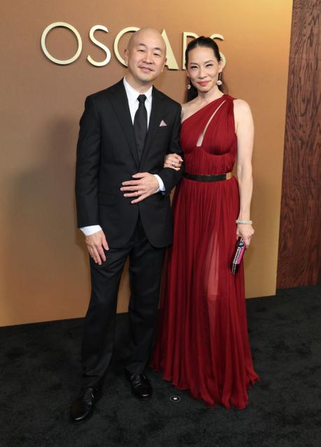 US actress producer Lucy Liu and cinematographer Eric Lin attend the 16th Governors Awards at the Ray Dolby Ballroom at Ovation Hollywood in Los Angeles on November 16, 2025. (Photo by VALERIE MACON / AFP)