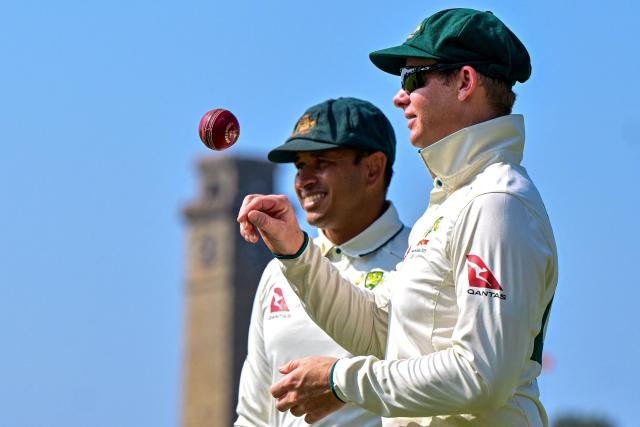 (FILES) Australia's captain Steve Smith (R) and Usman Khawaja look on during the first day of the second Test cricket match between Australia and Sri Lanka at the Galle International Cricket Stadium in Galle on February 6, 2025. Australia head into the Ashes on November 21, 2025 with an ageing "Dad's Army" group of players and concerns about a lack of depth to follow in their footsteps, but chief selector George Bailey is adamant the team's veteran core still has what it takes. (Photo by Ishara S. KODIKARA / AFP) / To go with AFP story Cricket-AUS-ENG-Ashes-age, FOCUS  by Martin Parry