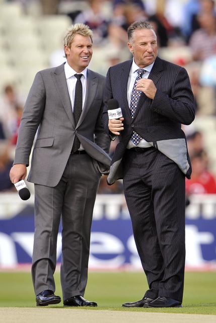 (FILES) Former cricketing greats Shane Warne of Australia (L) and Ian Botham of England (R), now commentators, before the start on the first day of the third Ashes cricket test between England and Australia at Edgbaston in Birmingham, central England on July 30, 2009. England and Australia begin the latest edition of the Ashes in Perth on November 21, 2025 with the visitors looking to wrestle back the urn for the first time since 2015. (Photo by WILLIAM WEST / AFP) / To go with AFP story Cricket-AUS-ENG-Ashes-series-five
