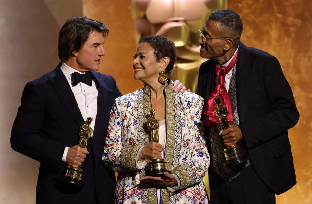 (L/R) US actor producer Tom Cruise, US actress dancer Debbie Allen and US production designer Wynn Thomas pose with their Honorary Academy Awards on stage during the 16th Governors Awards at the Ray Dolby Ballroom at Ovation Hollywood in Los Angeles on November 16, 2025. (Photo by Michael Tran / AFP)