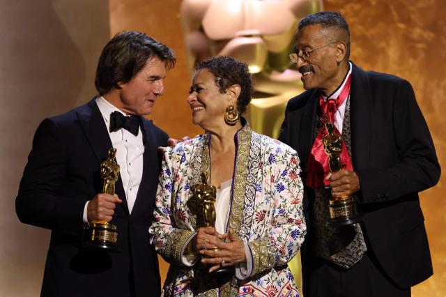 (L/R) US actor producer Tom Cruise, US actress dancer Debbie Allen and US production designer Wynn Thomas pose with their Honorary Academy Awards on stage during the 16th Governors Awards at the Ray Dolby Ballroom at Ovation Hollywood in Los Angeles on November 16, 2025. (Photo by Michael Tran / AFP)