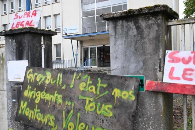 (FILES) Signs are photographed in front of the headquarters of NovAsco Hagondange, a special steel manufacturer, in Hagondange, northeastern France, on November 14, 2025. France's ministry of Industry announced to AFP on November 17 that the government will seek legal action against Greybull, the investment fund that took over Ascometal in 2024.
A decision by the commercial division of the Strasbourg court will be presented on November 17, after the takeover bids were presented on November 12. Ascometal was taken over on July 20, 2024 by Greybull investment fund under the name NovAsco. (Photo by Jean-Christophe VERHAEGEN / AFP)