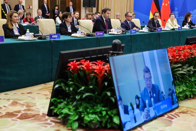 A German delegation including Vice Chancellor and Finance Minister Lars Klingbeil (3rd L) and President of the Deutsche Bundesbank Joachim Nagel (4th L) attend a high-level meeting at the Diaoyutai State Guesthouse in Beijing on November 17, 2025. (Photo by Maxim Shemetov / POOL / AFP)