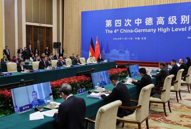 A German delegation including Vice Chancellor and Finance Minister Lars Klingbeil (2nd L) and President of the Deutsche Bundesbank Joachim Nagel (3rd L) attend a high-level meeting with Chinas Vice Premier He Lifeng (4th R) at the Diaoyutai State Guesthouse in Beijing on November 17, 2025. (Photo by Maxim Shemetov / POOL / AFP)