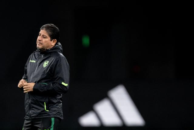 Bolivia's head coach Oscar Villegas looks on during a training session ahead of their friendly football match against Japan at the National Stadium in Tokyo on November 17, 2025. (Photo by Philip FONG / AFP)