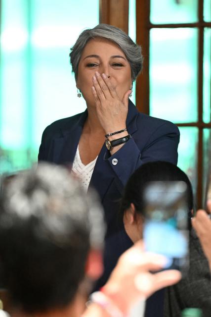 Leftist candidate Jeannette Jara blows a kiss during an event with women at La Pintana commune in Santiago, on November 17, 2025. Leftist candidate Jeannette Jara and far-right leader Jose Antonio Kast will go head-to-head in Chile's presidential run-off after topping the first round of voting in an election dominated by fears of violent crime. (Photo by MARVIN RECINOS / AFP)