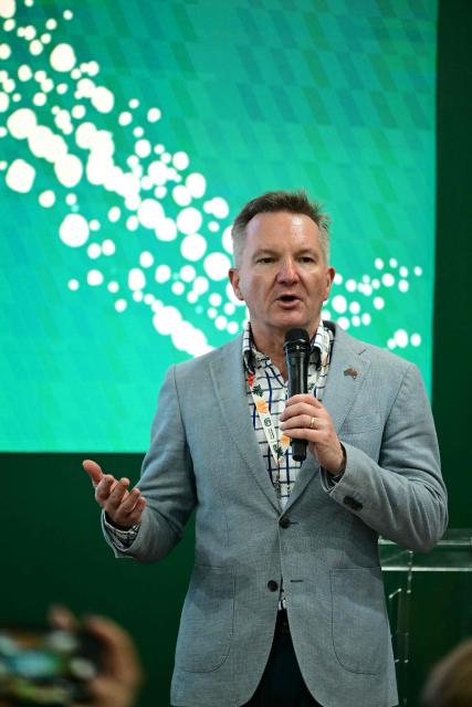 The Minister for Climate Change and Energy of Australia, Chris Bowen, speaks at Australia's pavilion during the COP30 UN Climate Change Conference in Belem, Para State, Brazil, on November 17, 2025. Bowen launched into public appearances on his first day at COP30 on Monday, making a light-hearted quip about the hosting war before a friendly crowd at the Australian pavilion. "I am in the middle of a lot of negotiations -- and not just about the most obvious things," Bowen said with a smile, drawing laughs from the crowd. Resolving the COP31 standoff is Bowen's top priority in Belem and the minister has bilateral meetings scheduled with his Turkish climate counterpart, Murat Kurum, a senior Australian government source told AFP. (Photo by Pablo PORCIUNCULA / AFP)