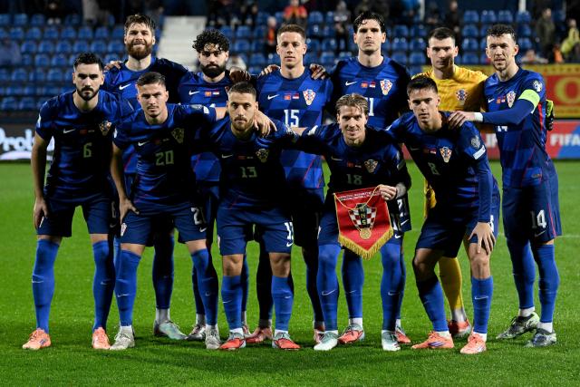 Croatia's players pose for a team photo ahead of the FIFA World Cup 2026 European qualification Group L football football match between between Montenegro and Croatia at Gradski Stadium in Podgorica on November 17, 2025. (Photo by SAVO PRELEVIC / AFP)