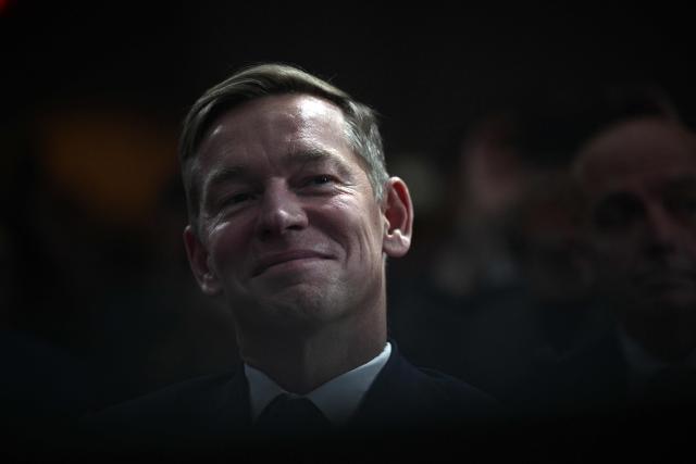 McDonald's CEO Chris Kempczinski listens to US President Donald Trump's remarks at McDonald's Impact Summit in Washington, DC on November 17, 2025. (Photo by Brendan SMIALOWSKI / AFP)