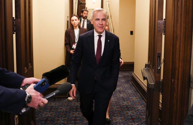 Canada's Prime Minister Mark Carney arrives for the final vote on State budget on Parliament Hill in Ottawa, Ontario, Canada on November 17, 2025. Canada's Liberal government survived a confidence vote on November 17, as parliament narrowly passed a budget Prime Minister Mark Carney says is essential to bolster an economy threatened by US tariffs. 
The minority Liberal government faced collapse over the cliffhanger budget vote, but a small group of opposition lawmakers -- weary of triggering a snap election -- allowed the fiscal plan to pass. (Photo by Dave Chan / AFP)