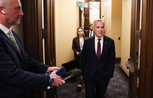 Canada's Prime Minister Mark Carney arrives for the final vote on State budget on Parliament Hill in Ottawa, Ontario, Canada on November 17, 2025. Canada's Liberal government survived a confidence vote on November 17, as parliament narrowly passed a budget Prime Minister Mark Carney says is essential to bolster an economy threatened by US tariffs. 
The minority Liberal government faced collapse over the cliffhanger budget vote, but a small group of opposition lawmakers -- weary of triggering a snap election -- allowed the fiscal plan to pass. (Photo by Dave Chan / AFP)