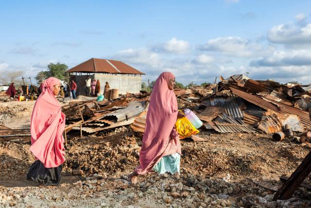 Villagers walk through the rubble of their village that was allegedly destroyed by retreating insurgents at Awdheegle, one of several towns recently liberated from the Al-Qaeda-linked militants, Al-Shabaab, by the SNA in Somalia's lower-Shabelle region on November 11, 2025. Somalia has been fighting Al-Shabaab since mid-2000s, and settlements like Awdheegle, Sabiid and Canole have changed hands multiple times.
In 2022 and 2023, the national army made significant progress, capturing some 200 towns and villages from Al-Shabaab.
But Al-Shabaab launched a new offensive early this year, retaking some 90 percent of that territory -- including three critical bridges along the Shabelle River vital for access to the capital.
The army is pushing back, but must do so just as international assistance is faltering. (Photo by Tony KARUMBA / AFP)