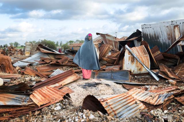 A woman stands in the rubble of their village that was allegedly destroyed by retreating insurgents at Awdheegle, one of several towns recently liberated from the Al-Qaeda-linked militants, Al-Shabaab, by the SNA in Somalia's lower-Shabelle region on November 11, 2025. Somalia has been fighting Al-Shabaab since mid-2000s, and settlements like Awdheegle, Sabiid and Canole have changed hands multiple times.
In 2022 and 2023, the national army made significant progress, capturing some 200 towns and villages from Al-Shabaab.
But Al-Shabaab launched a new offensive early this year, retaking some 90 percent of that territory -- including three critical bridges along the Shabelle River vital for access to the capital.
The army is pushing back, but must do so just as international assistance is faltering. (Photo by Tony KARUMBA / AFP)