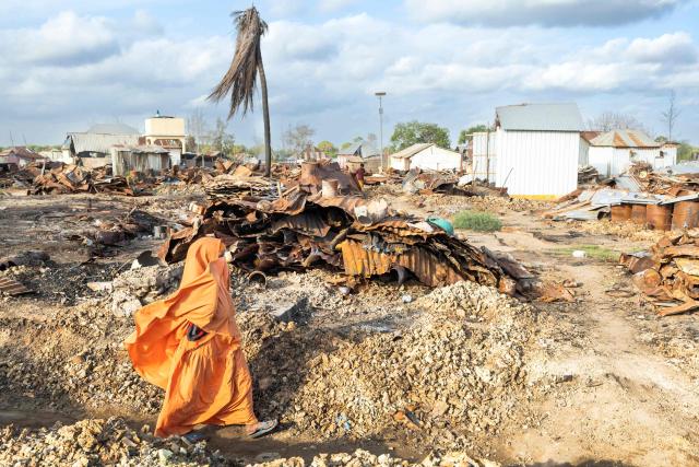 A villager walks through the rubble of their village that was allegedly destroyed by retreating insurgents at Awdheegle, one of several towns recently liberated from the Al-Qaeda-linked militants, Al-Shabaab, by the SNA in Somalia's lower-Shabelle region on November 11, 2025. Somalia has been fighting Al-Shabaab since mid-2000s, and settlements like Awdheegle, Sabiid and Canole have changed hands multiple times.
In 2022 and 2023, the national army made significant progress, capturing some 200 towns and villages from Al-Shabaab.
But Al-Shabaab launched a new offensive early this year, retaking some 90 percent of that territory -- including three critical bridges along the Shabelle River vital for access to the capital.
The army is pushing back, but must do so just as international assistance is faltering. (Photo by Tony KARUMBA / AFP)