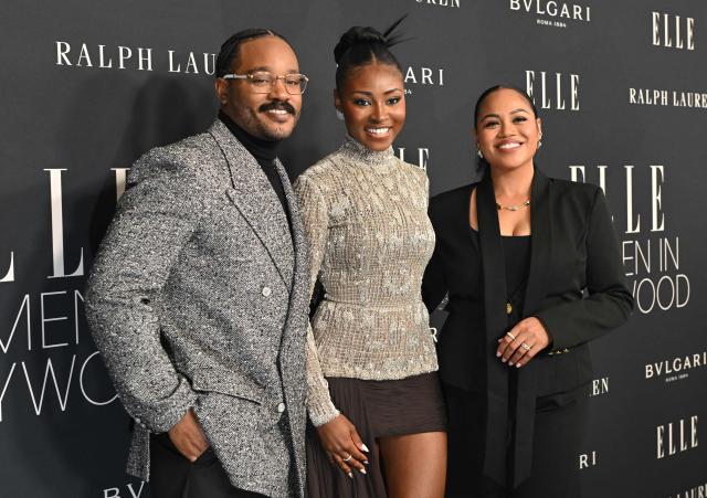 US actress Jayme Lawson (C) poses with US filmmaker Ryan Coogler (L) and his wife Zinzi Evans (R) as they attend Elle 2025 Women in Hollywood celebration at the Four Seasons hotel in Beverly Hills, California on November 17, 2025. (Photo by Lisa O'CONNOR / AFP)