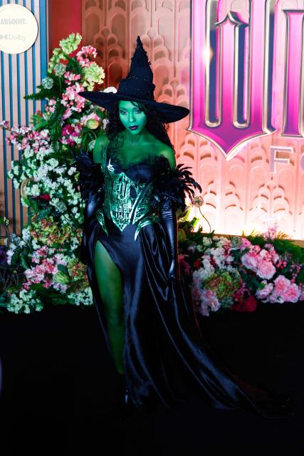 A costumed guest attends the premiere of "Wicked: For Good" at Lincoln Center for the Performing Arts in New York on November 17, 2025. (Photo by kena betancur / AFP)