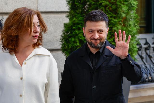 Ukraine's President Volodymyr Zelensky waves flanked by Francina Armengol, President of the Congress of Deputies during a visit to the Congress of Deputies in Madrid on November 18, 2025 (Photo by Pierre-Philippe MARCOU / AFP)