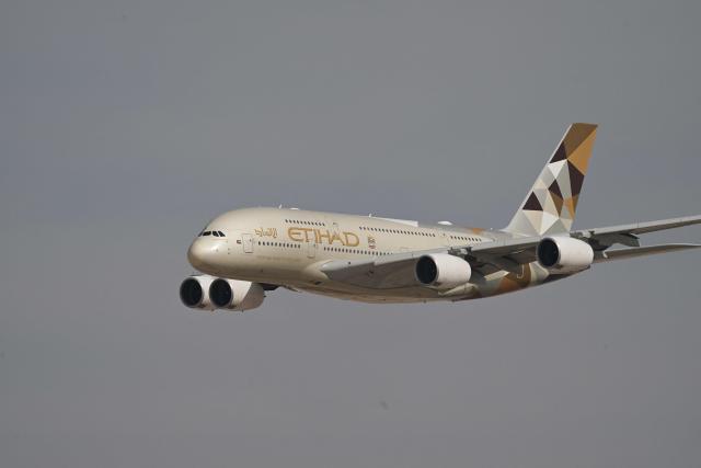 An Ethiad Airbus A380 performs a flypast at Al-Maktoum International Airport during the Dubai Airshow 2025 in Dubai on November 17, 2025. (Photo by Giuseppe CACACE / AFP)