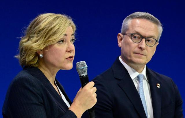 German Minister for Digitalization and State Modernization Karsten Wildberger (R) looks on as the European Union's Executive Vice-President for Tech Sovereignty, Security and Democracy Henna Virkkunen speaks at a panel discussion during a summit on Europe's technological sovereignty, on November 18, 2025 at the EUREF Campus in Berlin. The German Chancellor and the French President will join forces to push for greater European digital "sovereignty" and less dependence on US tech titans as the AI race gathers pace. The leaders of Europe's biggest economies will make the call at a Berlin summit, which will also be attended by CEOs of top regional firms including French AI company Mistral and German software giant SAP. With artificial intelligence set to play an increasingly important role in many sectors, Europe's leaders are responding to growing calls for the continent to take greater control of its own digital destiny. (Photo by John MACDOUGALL / AFP)
