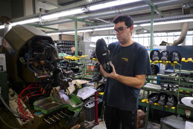 An employee works at the AMF safety shoes  factory in Tabuadelo, near Guimaraes, on November 17, 2025. (Photo by MIGUEL RIOPA / AFP)