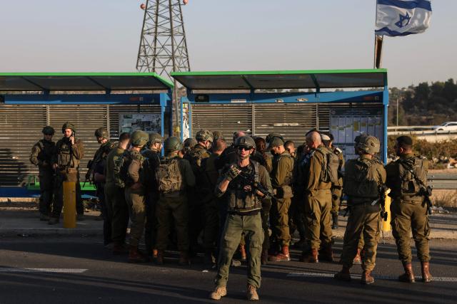 Israeli security forces stand at the site of a reported attack at the Gush Etzion Junction, in the Israeli-occupied West Bank, on November 18, 2025. The area of Gush Etzion Junction in the southern West Bank has seen repeated attacks against Israelis in recent years. (Photo by AHMAD GHARABLI / AFP)