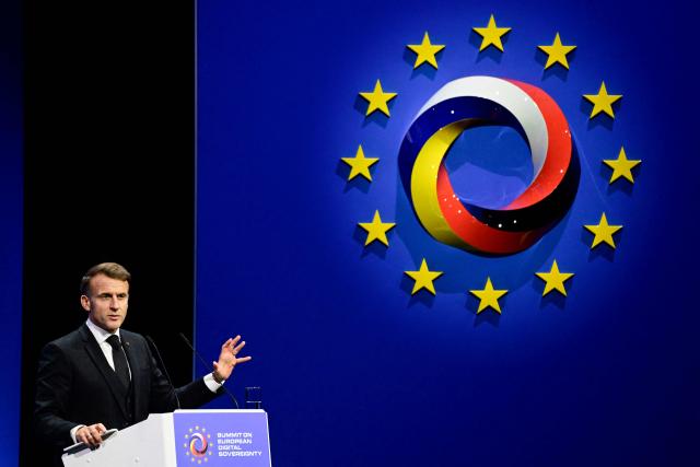 France's President Emmanuel Macron delivers a speech at the summit on Europe's technological sovereignty, on November 18, 2025 at the EUREF Campus in Berlin. The German Chancellor and the French President will join forces to push for greater European digital "sovereignty" and less dependence on US tech titans as the AI race gathers pace. The leaders of Europe's biggest economies will make the call at a Berlin summit, which will also be attended by CEOs of top regional firms including French AI company Mistral and German software giant SAP. With artificial intelligence set to play an increasingly important role in many sectors, Europe's leaders are responding to growing calls for the continent to take greater control of its own digital destiny. (Photo by John MACDOUGALL / AFP)