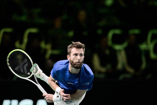 France's Corentin Moutet serves the ball to Belgium's Raphael Collignon during their Davis Cup men's singles quarter finals tennis match, at the Super Tennis Arena, in Bologna, northen Italy, on November 18, 2025. (Photo by Tiziana FABI / AFP)