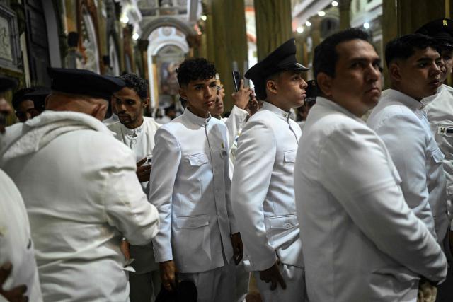 Members of the Servants of Mary religious society take part in a pilgrimage of Our Lady of the Rosary of Chiquinquira (Virgin of Chiquinquira) in Maracaibo, Zulia state, Venezuela, on November 18, 2025. (Photo by Juan BARRETO / AFP)