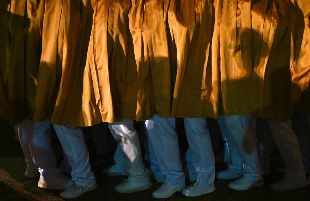 Members of the Servants of Mary religious society carry an image of Our Lady of the Rosary of Chiquinquira (Virgin of Chiquinquira) during a pilgrimage in Maracaibo, Zulia state, Venezuela, on November 18, 2025. (Photo by Juan BARRETO / AFP)
