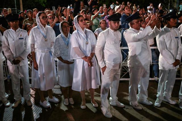 Members of the Servants of Mary religious society take part in a pilgrimage of Our Lady of the Rosary of Chiquinquira (Virgin of Chiquinquira) in Maracaibo, Zulia state, Venezuela, on November 18, 2025. (Photo by Juan BARRETO / AFP)