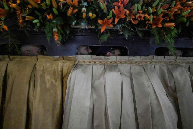 Members of the Servants of Mary religious society carry an image of Our Lady of the Rosary of Chiquinquira (Virgin of Chiquinquira) during a pilgrimage in Maracaibo, Zulia state, Venezuela, on November 18, 2025. (Photo by Juan BARRETO / AFP)