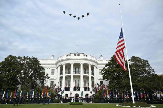 US President Donald Trump and Crown Prince and Prime Minister of the Kingdom of Saudi Arabia Mohammed bin Salman watch a flyover of military aircraft on the South Lawn at the White House in Washington, DC on November 18, 2025. Saudi Crown Prince Mohammed bin Salman arrived at the White House to fanfare and a jet flyover Tuesday, in his first visit to the United States since the 2018 murder of journalist Jamal Khashoggi. (Photo by Brendan SMIALOWSKI / AFP)