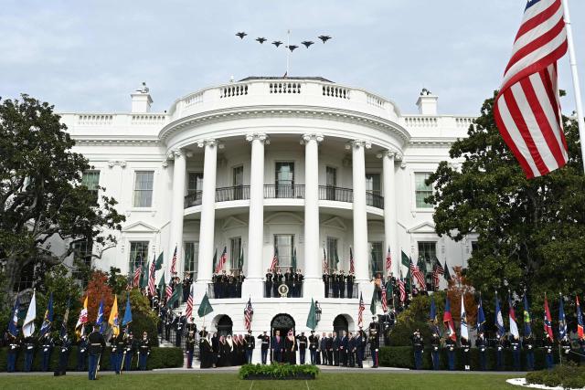US President Donald Trump and Crown Prince and Prime Minister of the Kingdom of Saudi Arabia Mohammed bin Salman watch a flyover of military aircraft on the South Lawn at the White House in Washington, DC on November 18, 2025. Saudi Crown Prince Mohammed bin Salman arrived at the White House to fanfare and a jet flyover Tuesday, in his first visit to the United States since the 2018 murder of journalist Jamal Khashoggi. (Photo by Brendan SMIALOWSKI / AFP)