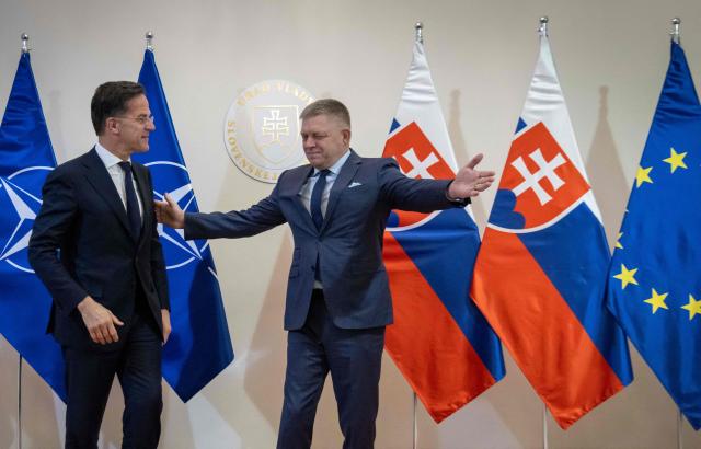 Prime Minister of Slovakia Robert Fico (R) welcomes NATO Secretary General Mark Rutte during his visit in Bratislava, Slovakia on November 18, 2025. (Photo by TOMAS BENEDIKOVIC / AFP)
